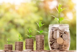 coins in jar showing growth